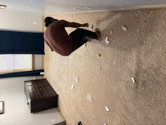 guy removing carpet