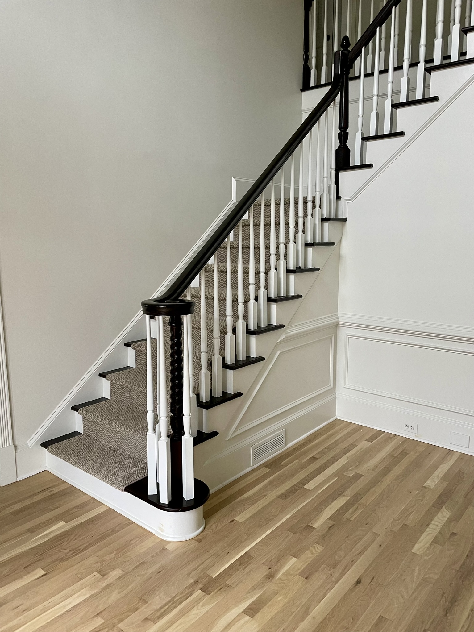 painted handrails with white, sculpted balusters